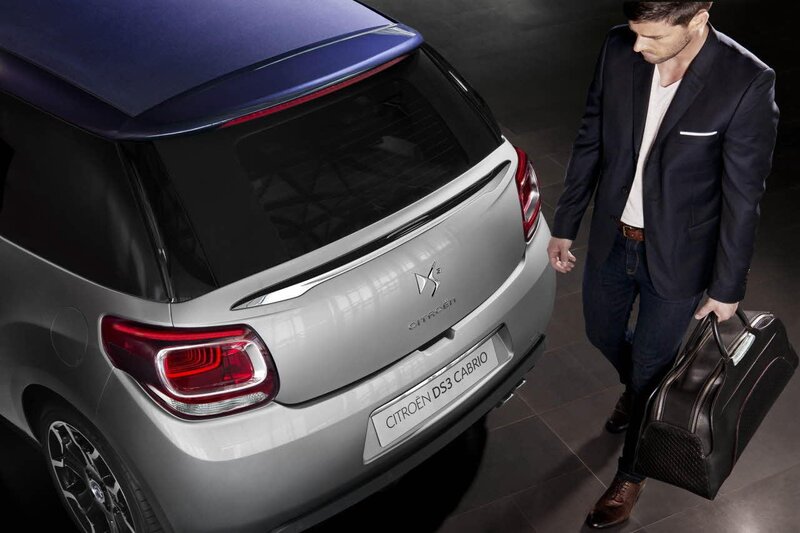 Man with suitcase near Citroen DS3 Cabrio
