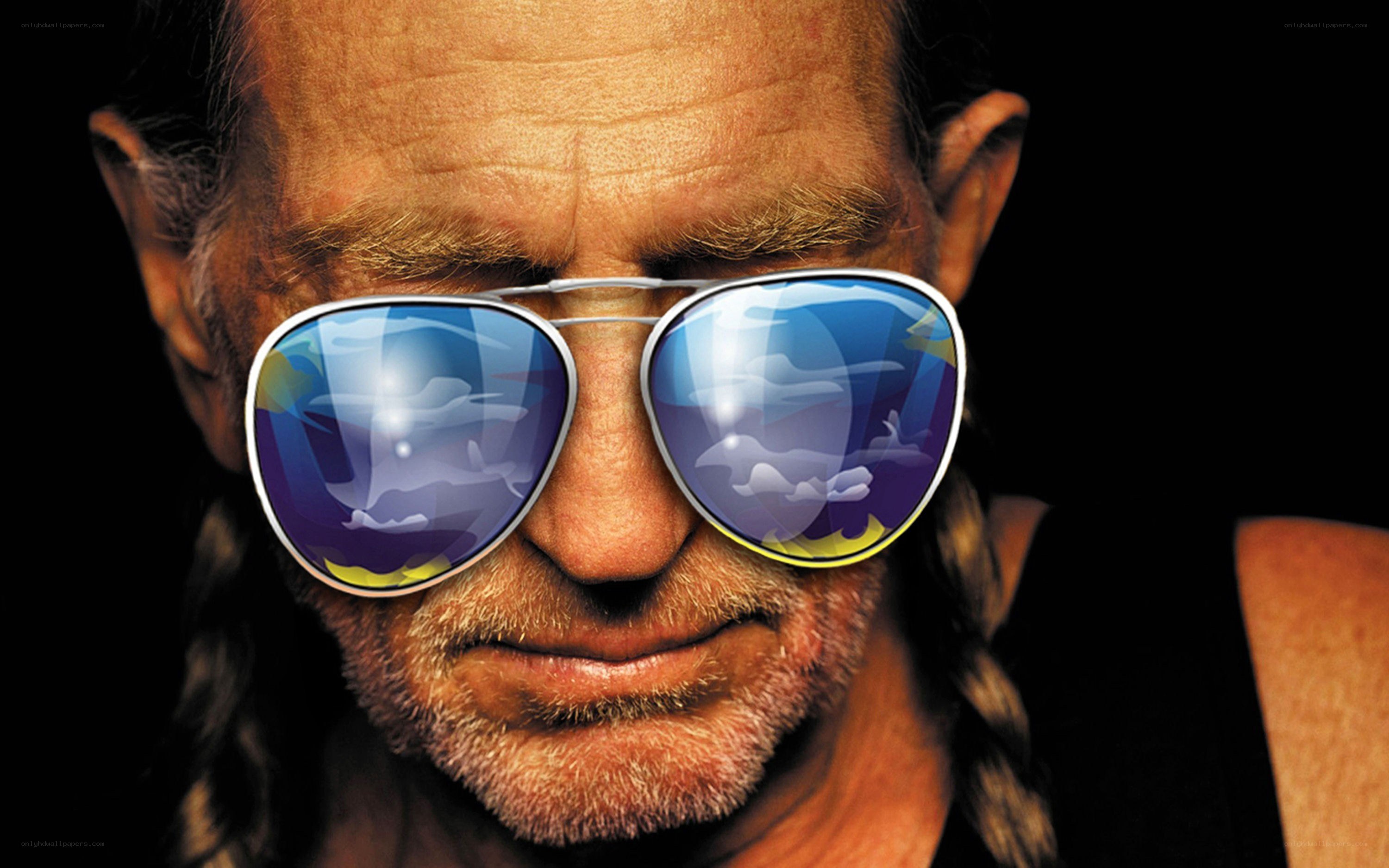 man with sunglasses and braids