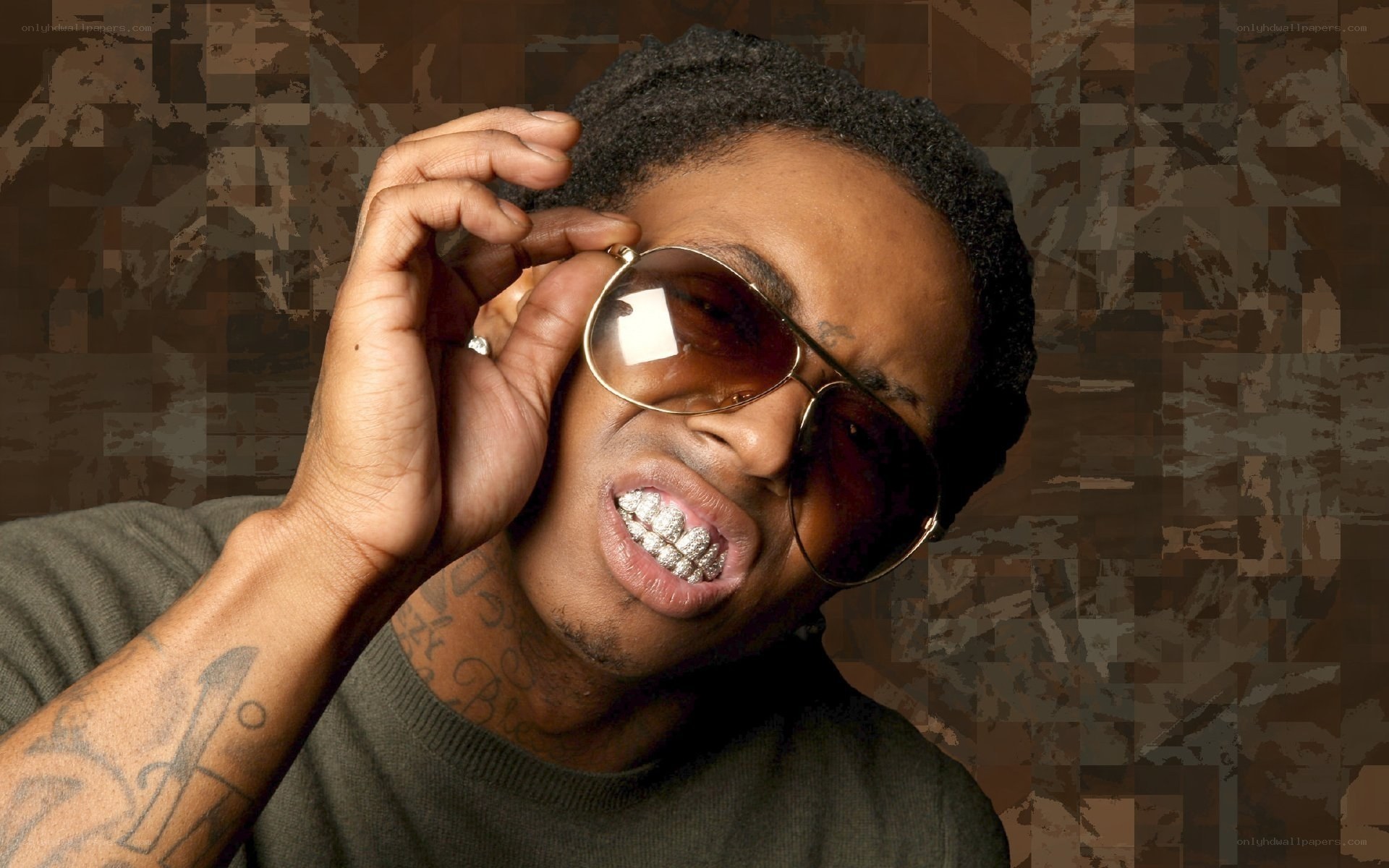 man with sunglasses and grillz