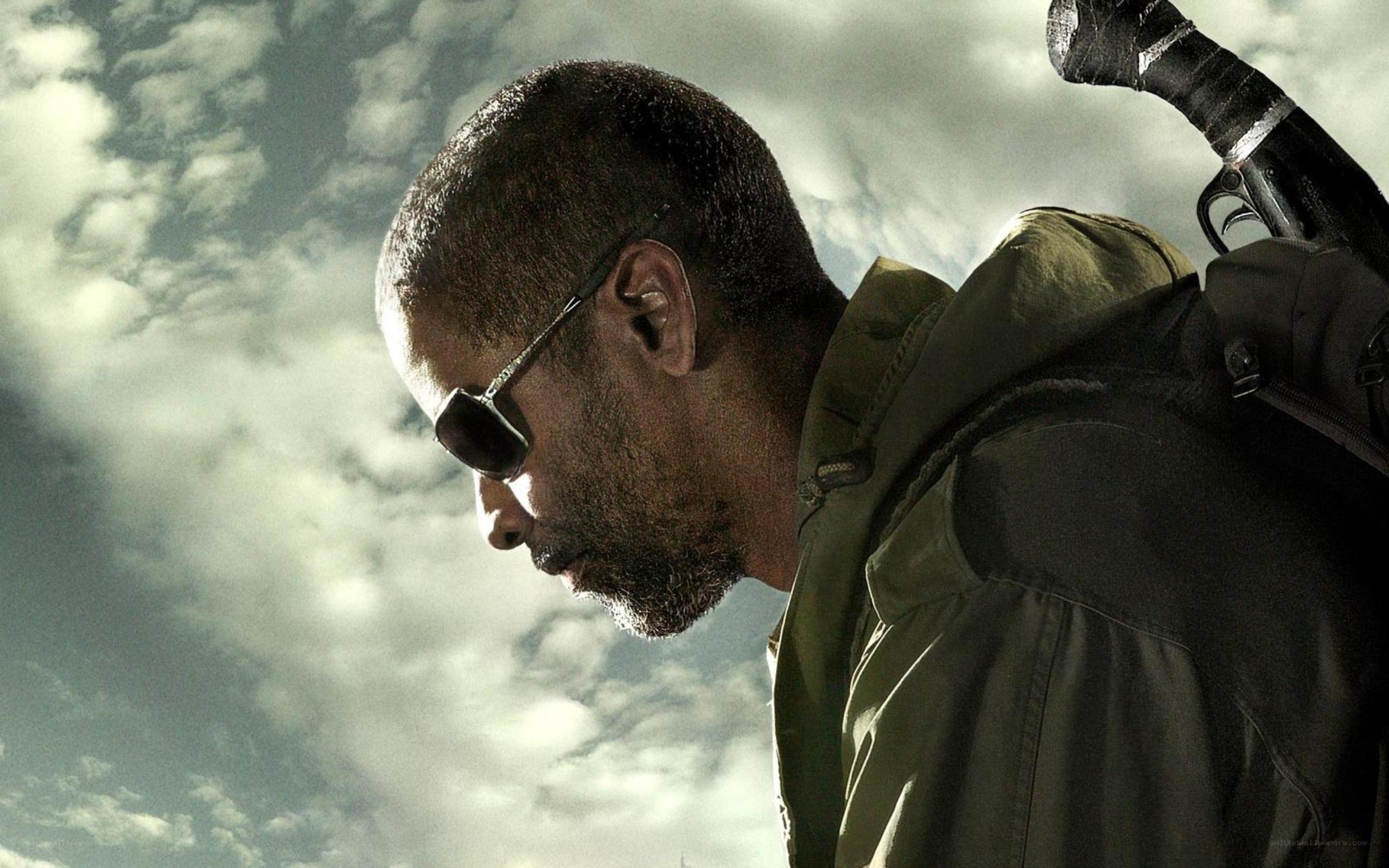 man with sunglasses and gun