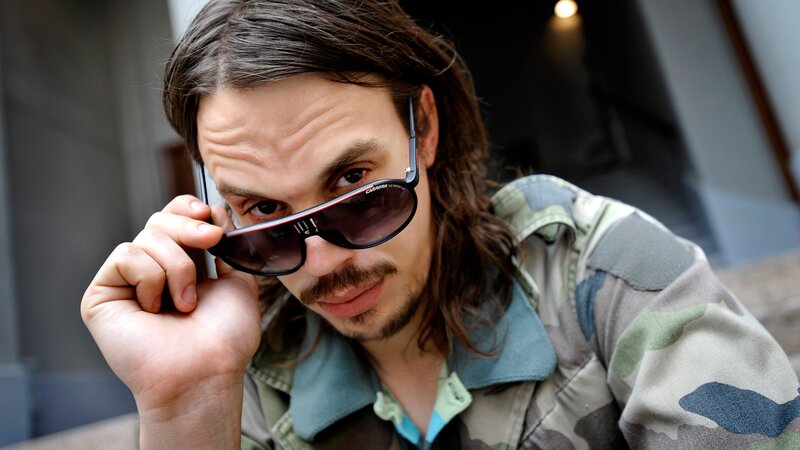 man with sunglasses and long hair