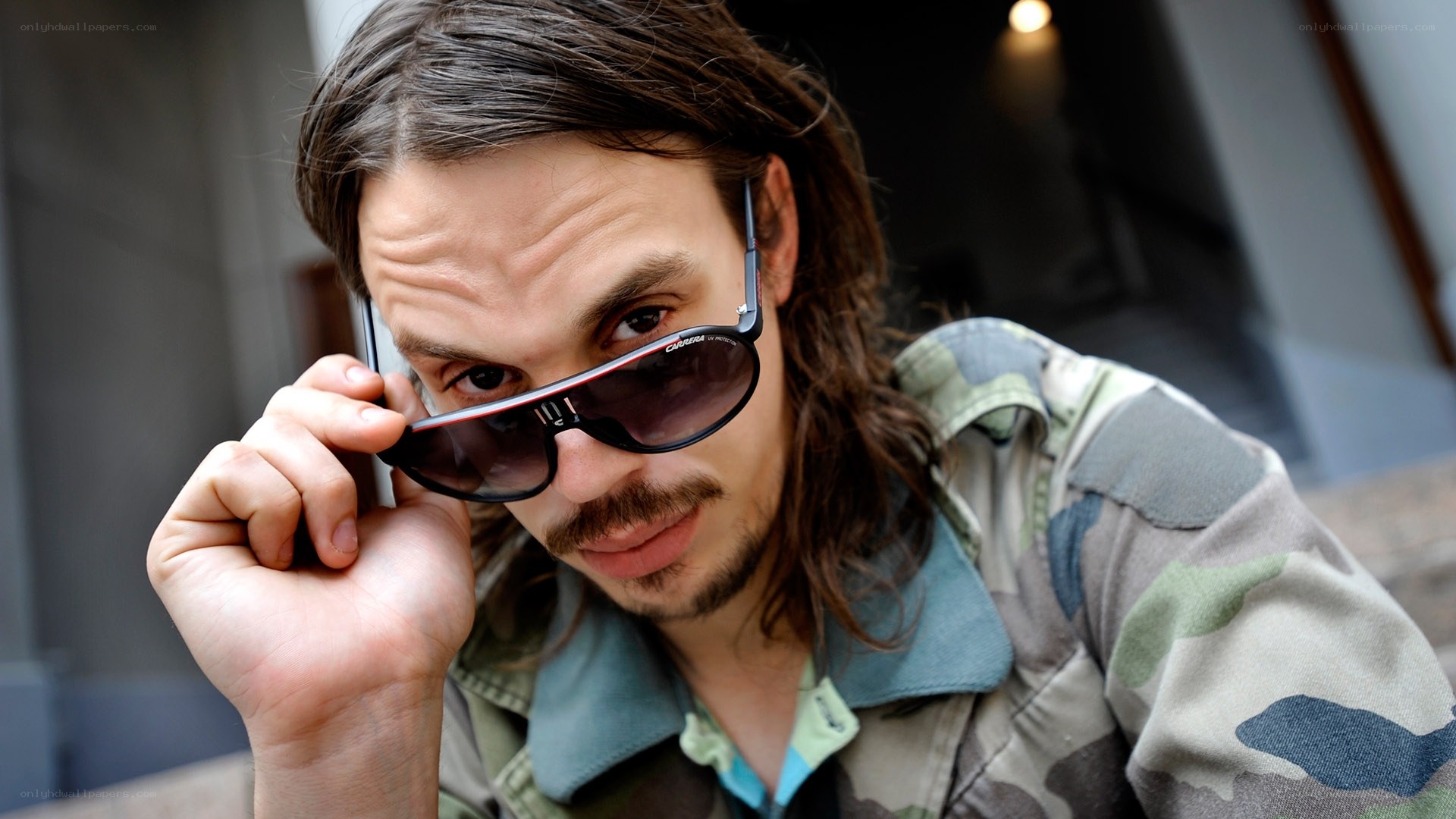 man with sunglasses and long hair