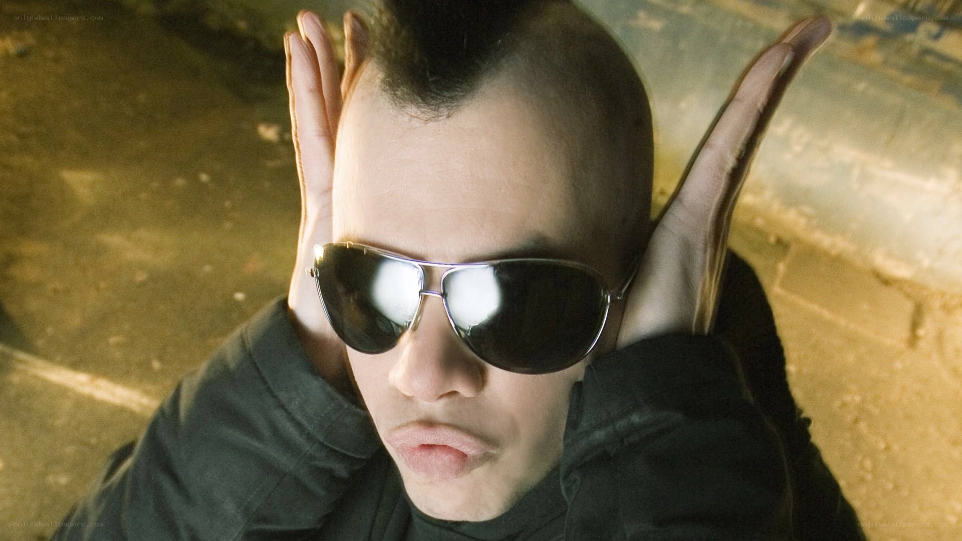 man with sunglasses and mohawk