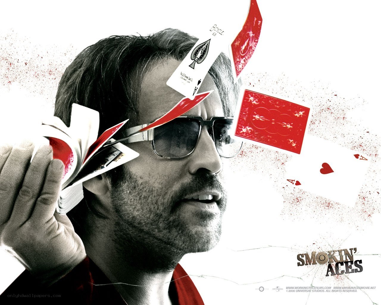 Man with sunglasses and playing cards