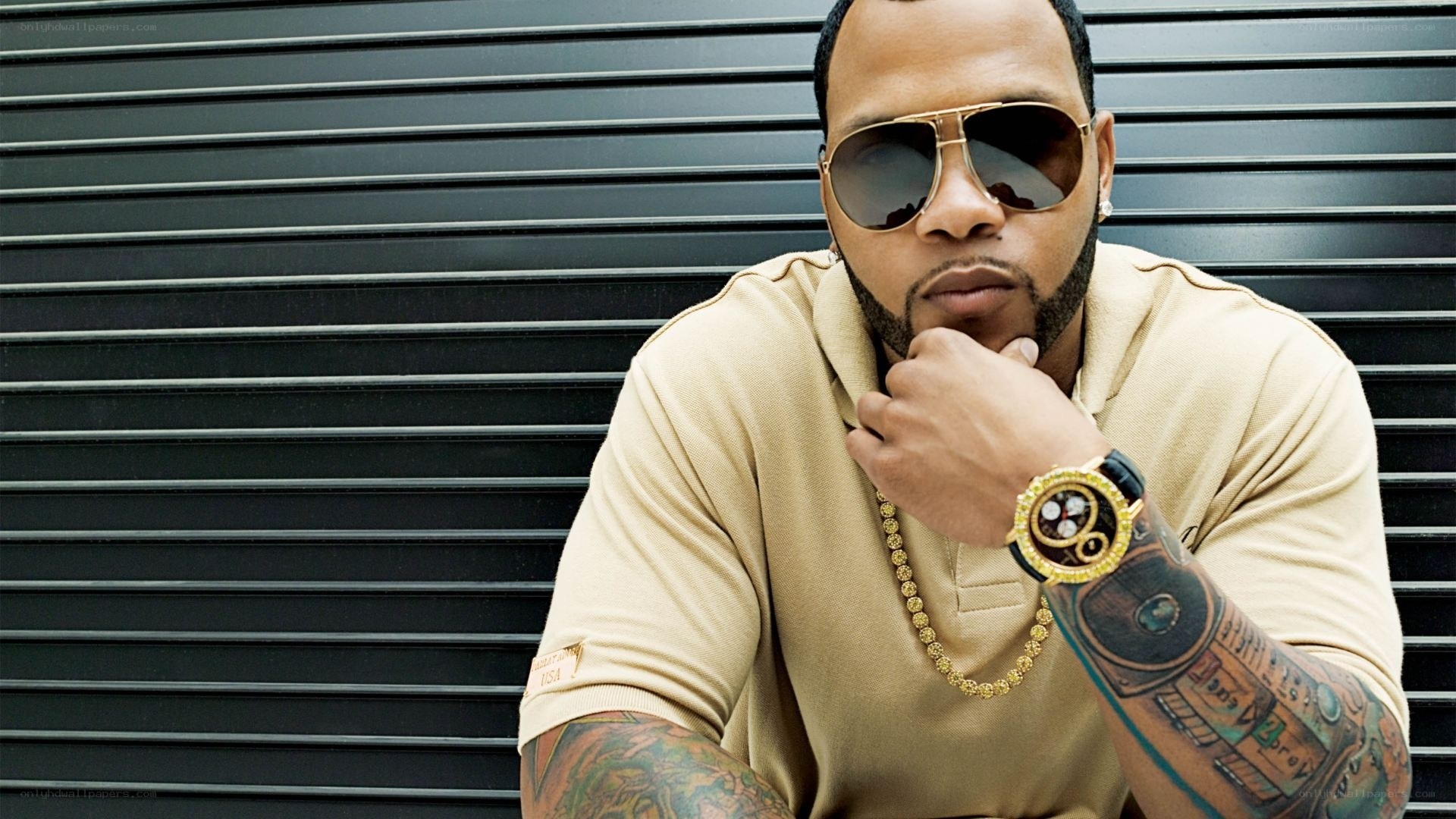 man with sunglasses and tattoos