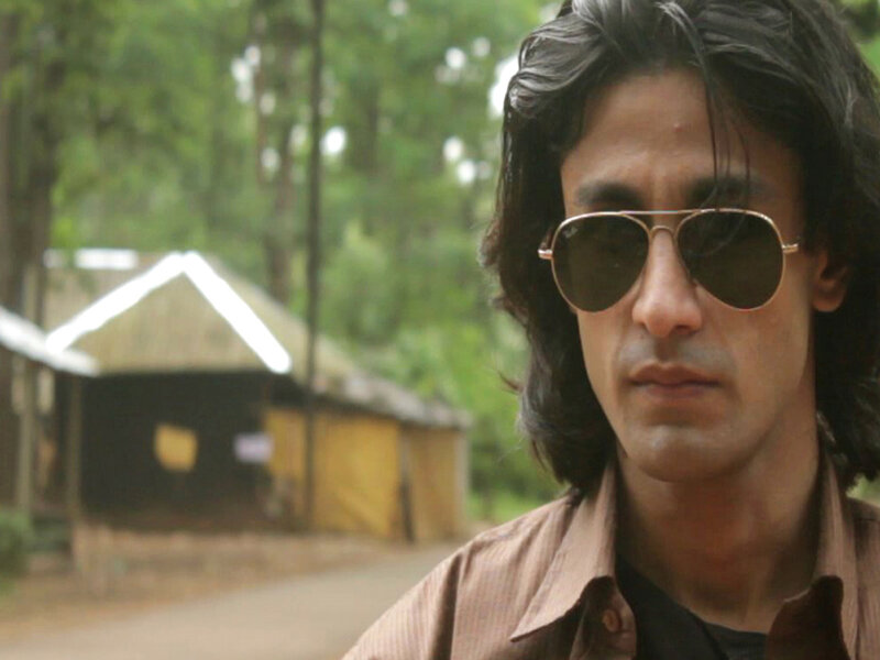 Man with Sunglasses — Brown, Serious