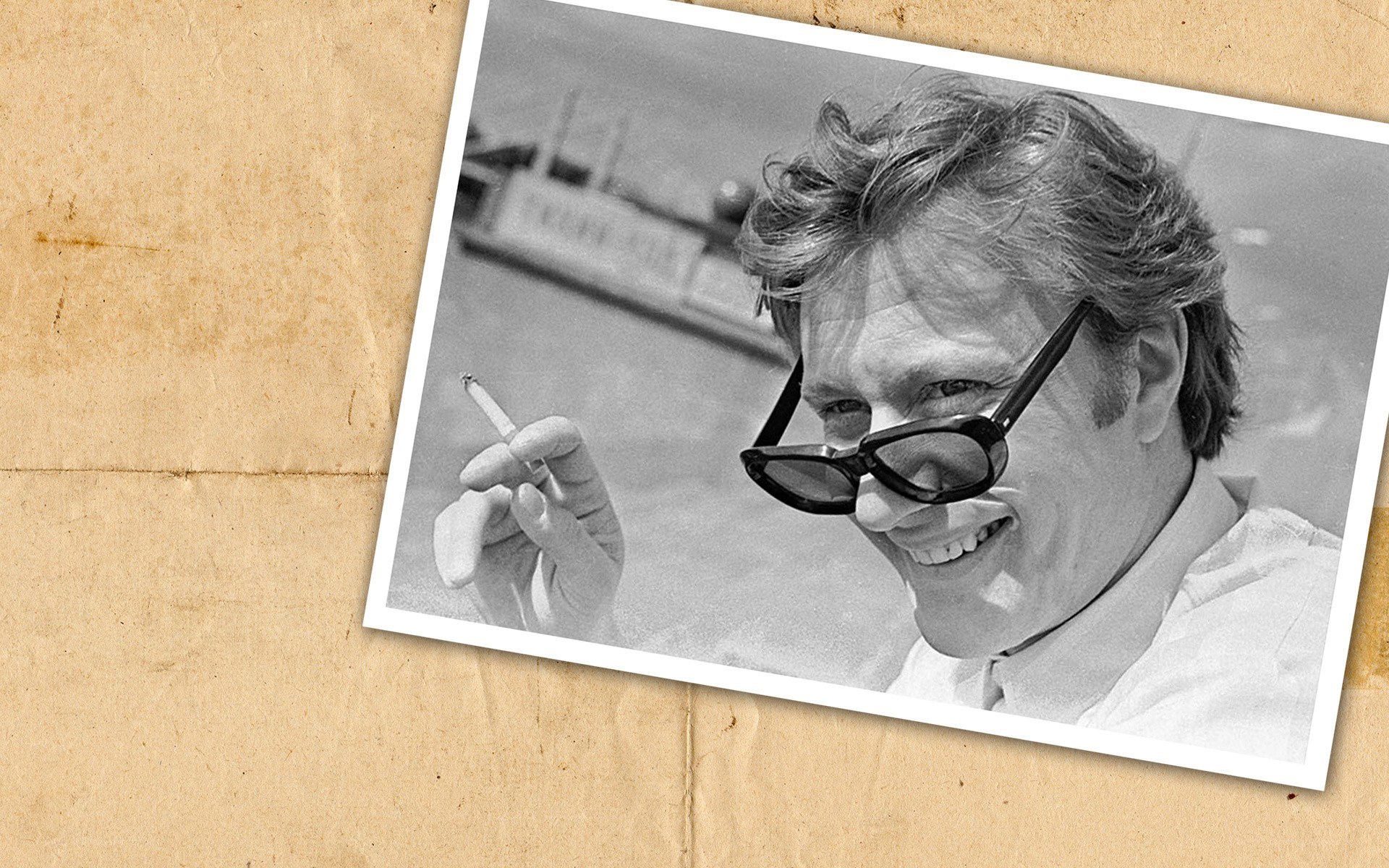 Man with sunglasses holding cigarette