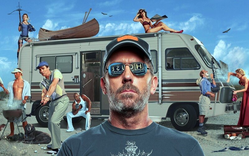 man with sunglasses in front of RV