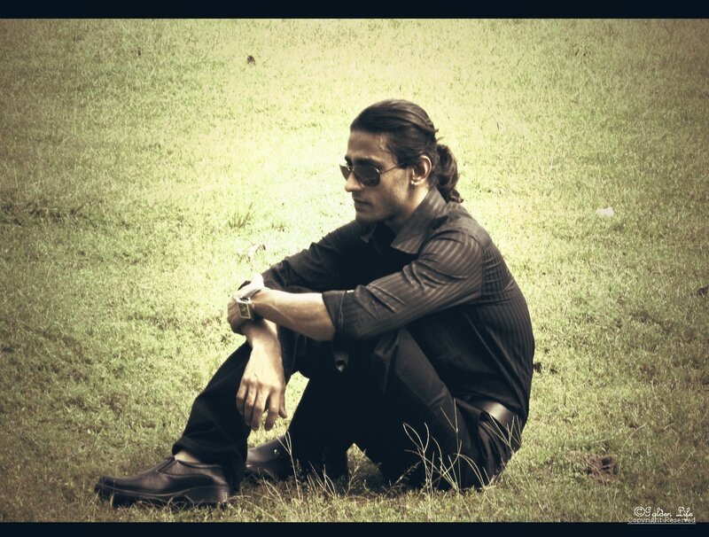 Man with Sunglasses Sitting
