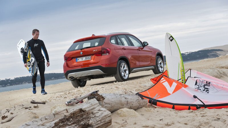 Man with surfboard on beach
