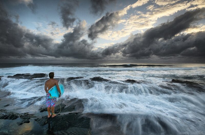 Man with Surfboard