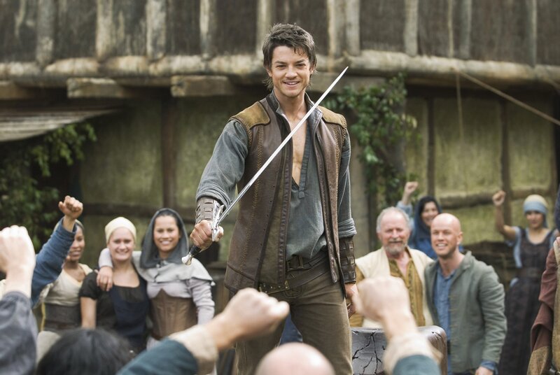 Man with sword in crowd