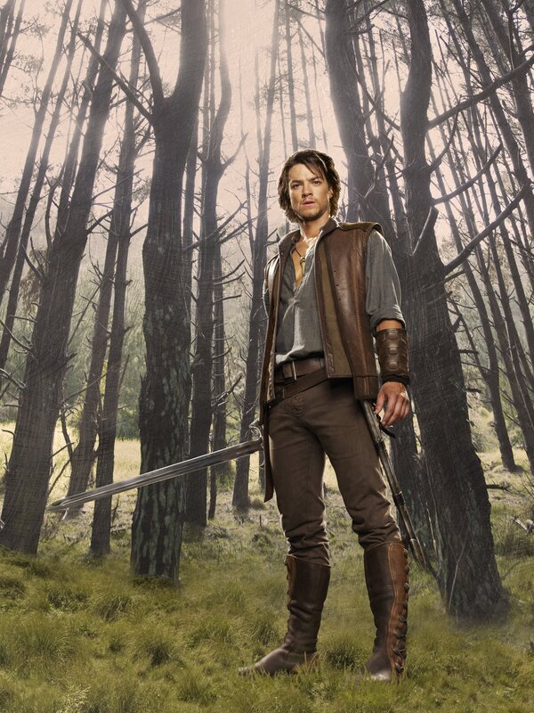 Man with sword in forest
