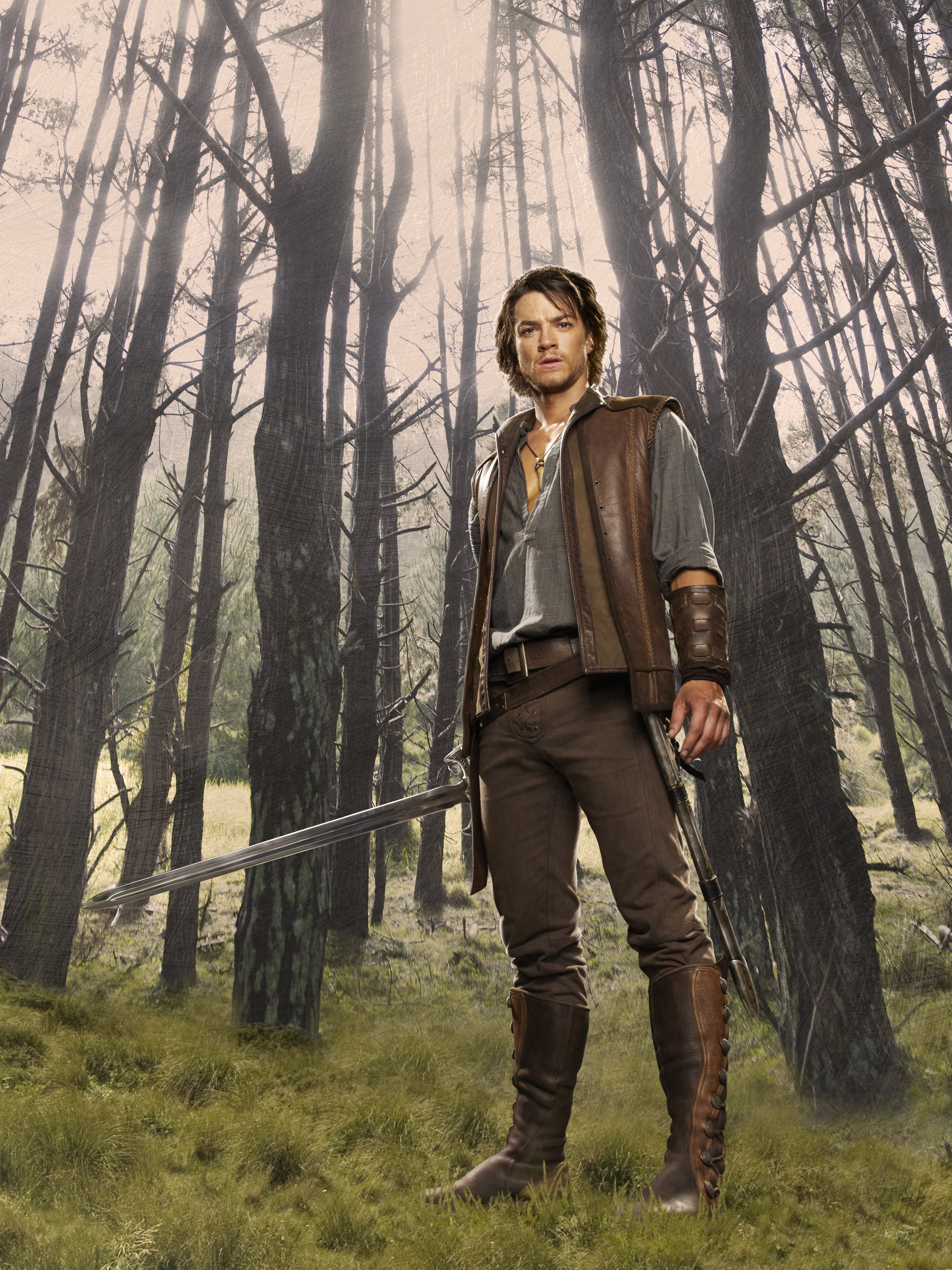 Man with sword in forest