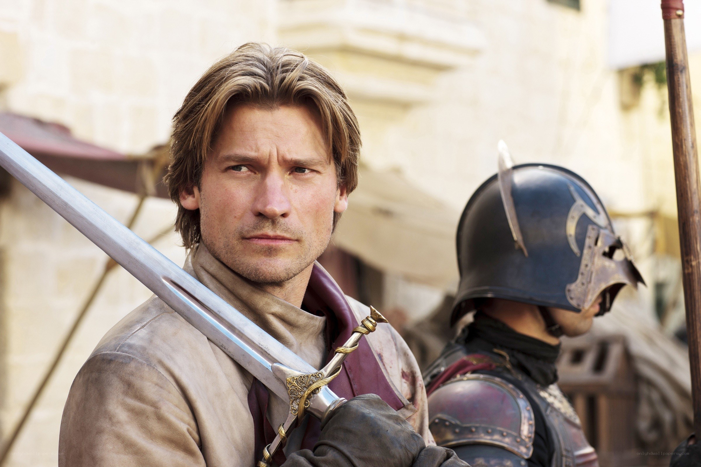 man with sword in medieval setting