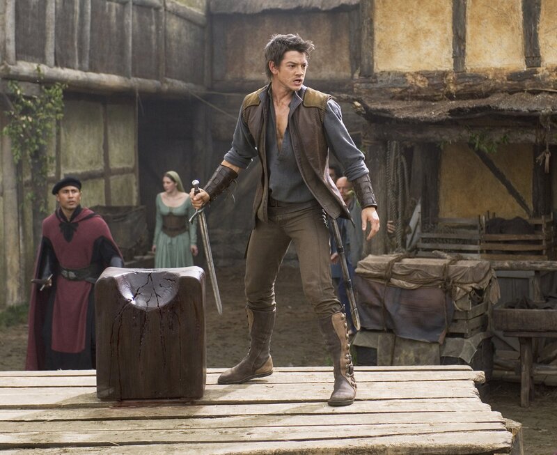 Man with sword in medieval village