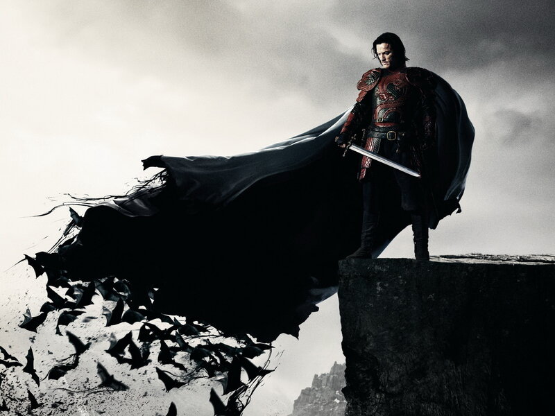 man with sword on cliff