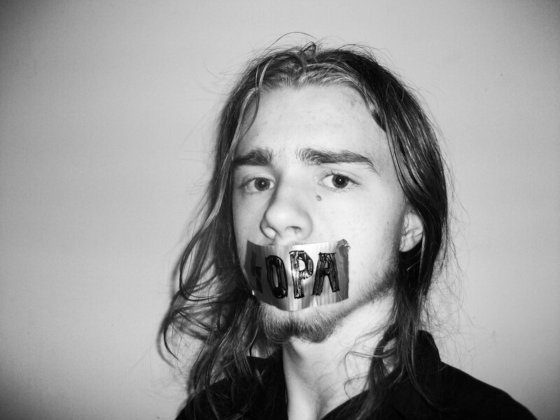 Man with Tape over Mouth — Black, Dramatic, Photograph, Long Hair