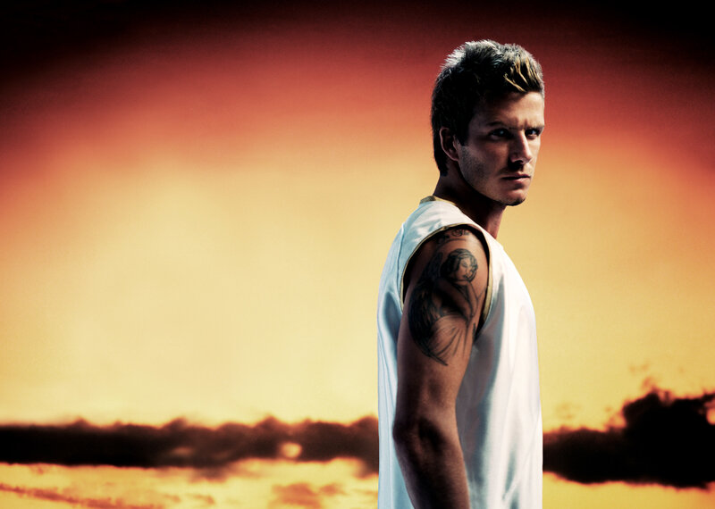 man with tattoo at sunset