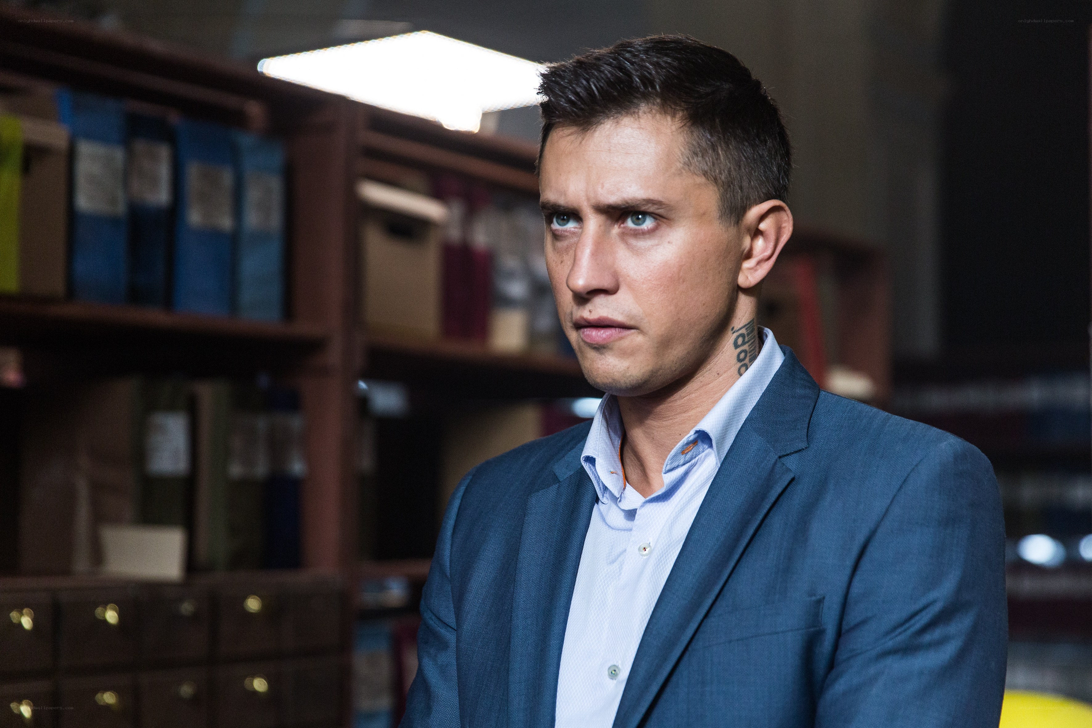 Man with tattoo in office