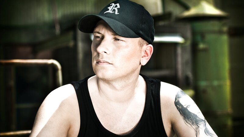 man with tattoo wearing cap