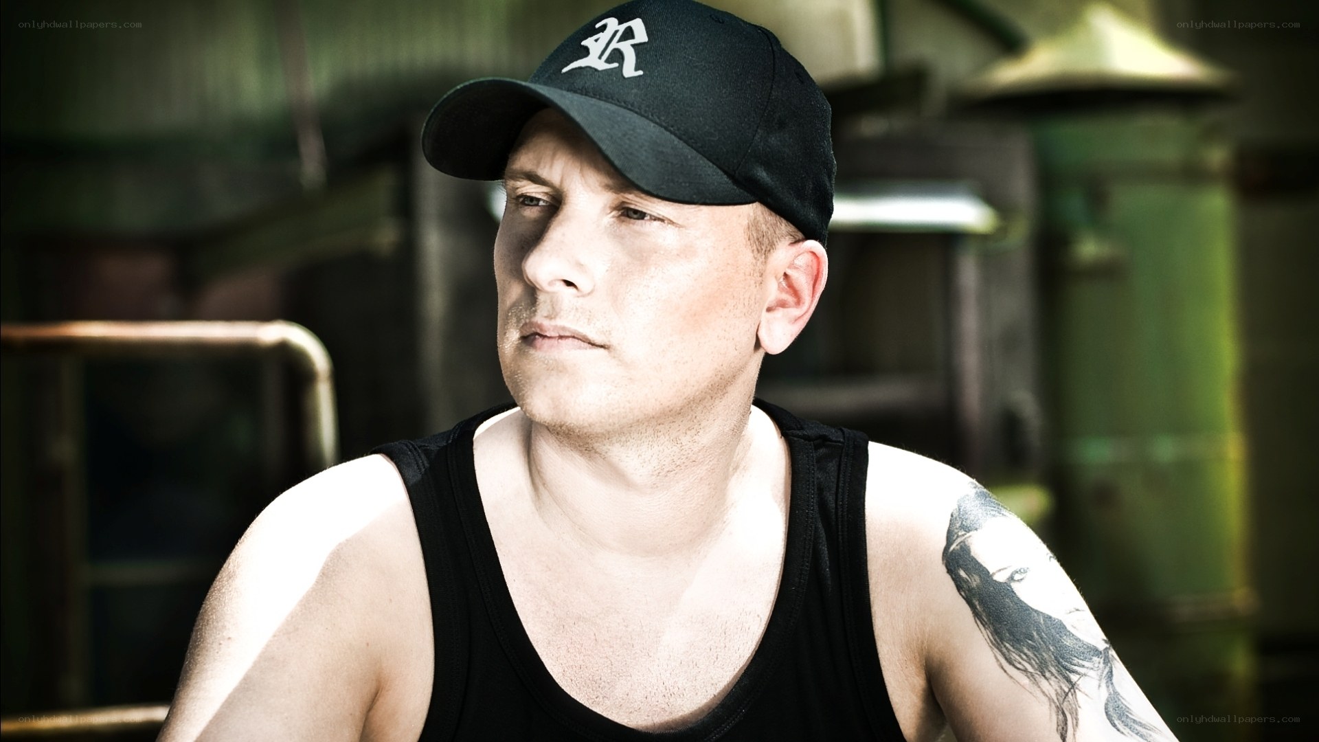man with tattoo wearing cap