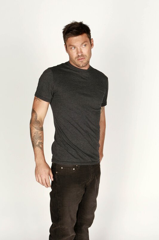man with tattoo wearing t-shirt