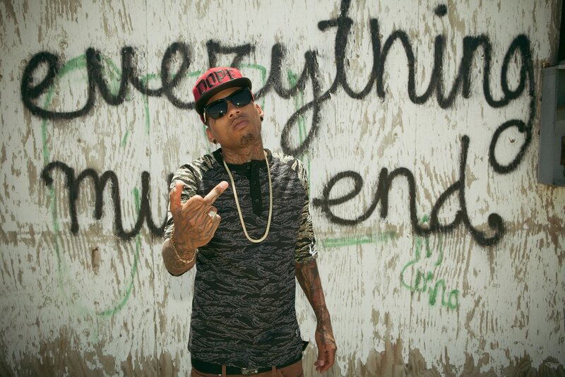 man with tattoos and cap
