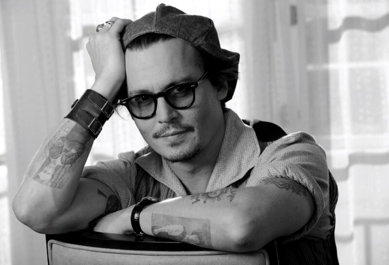 Man with Tattoos and Glasses — Black, Contemplative