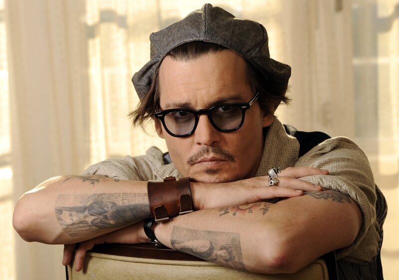Man with Tattoos and Glasses — Brown, Contemplative, Afternoon