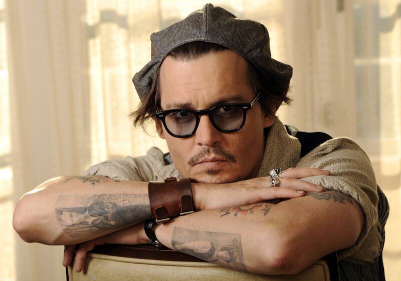 Man with Tattoos and Glasses — Brown, Contemplative, Photograph