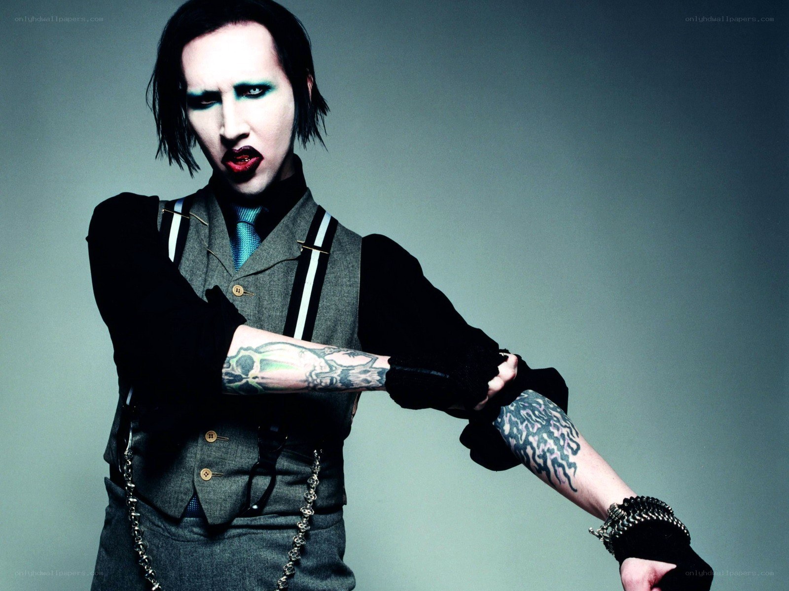 Man with tattoos and makeup