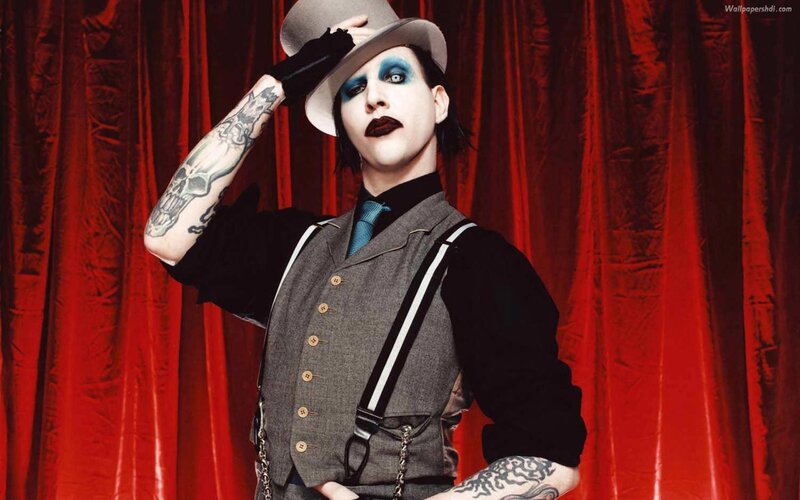 man with tattoos and makeup