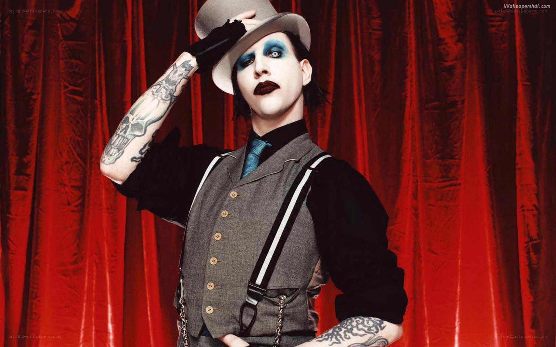 man with tattoos and makeup