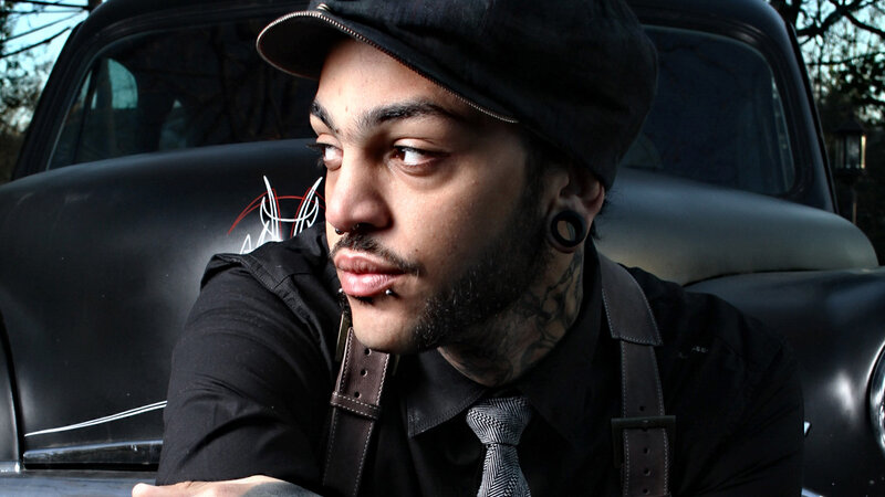Man with Tattoos and Piercings — Black
