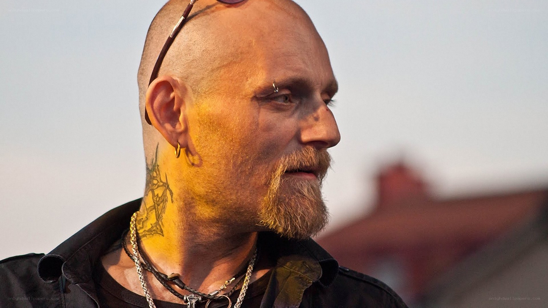 man with tattoos and piercings