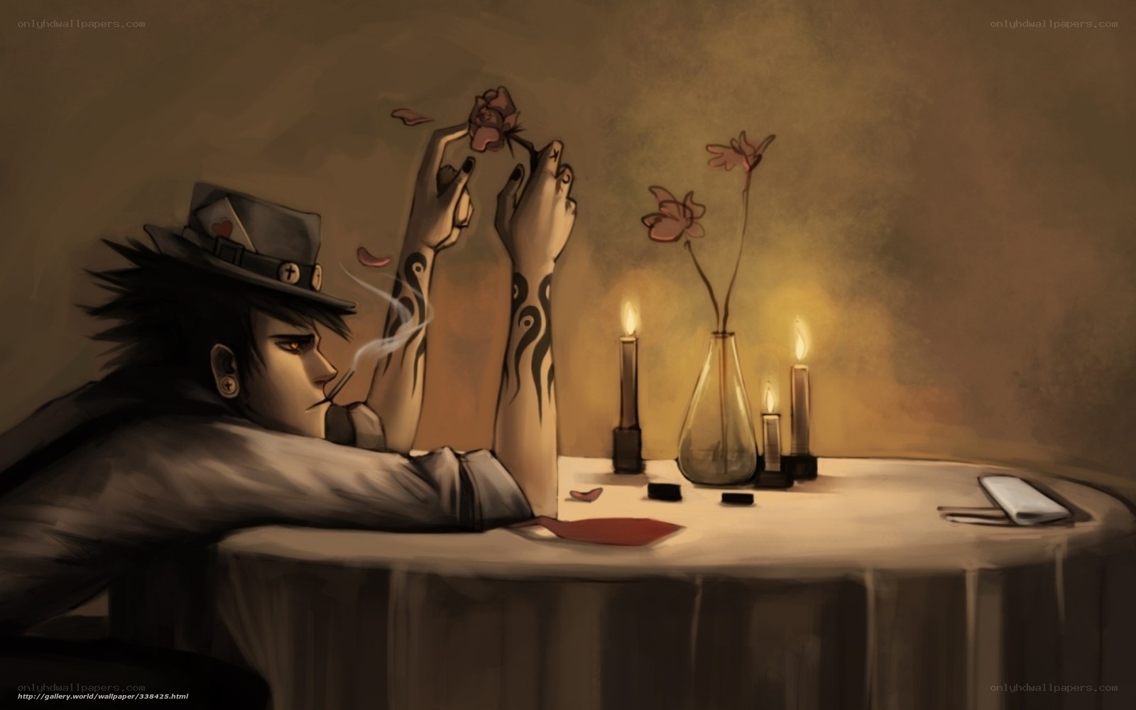 man with tattoos at candlelit table