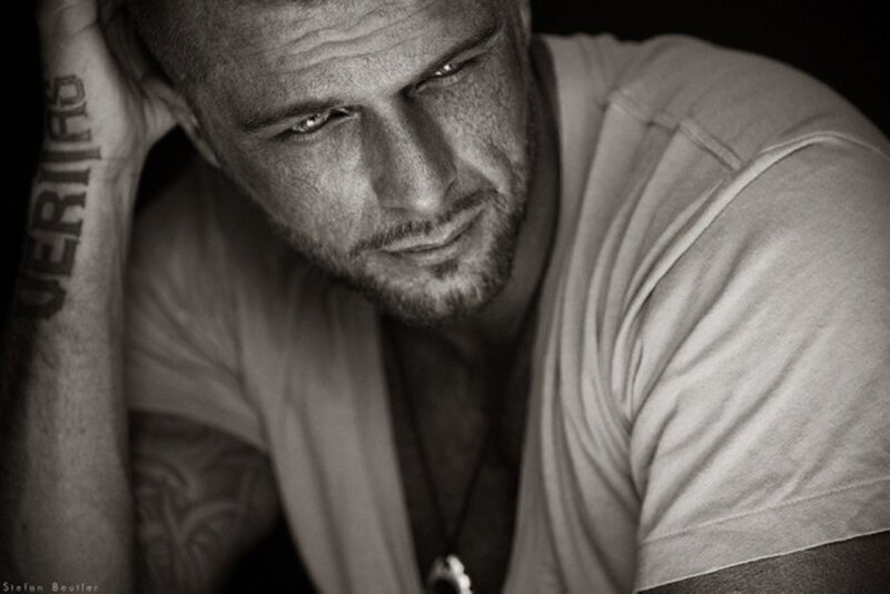 Man with Tattoos — Black, Dramatic, Photograph, Tattoo, Necklace