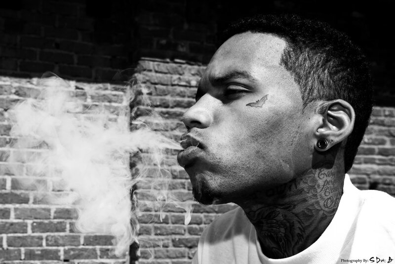 Man with Tattoos Exhaling Smoke — Black