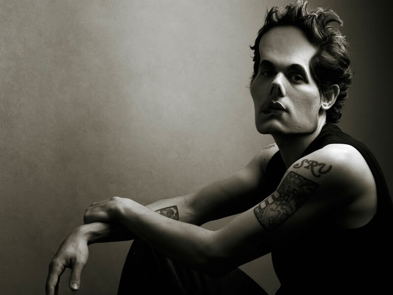 man with tattoos in black and white
