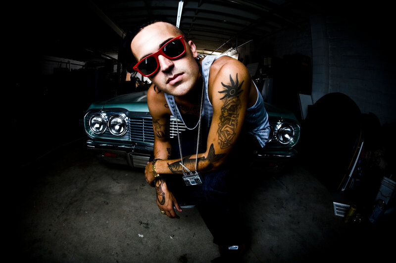 man with tattoos in garage