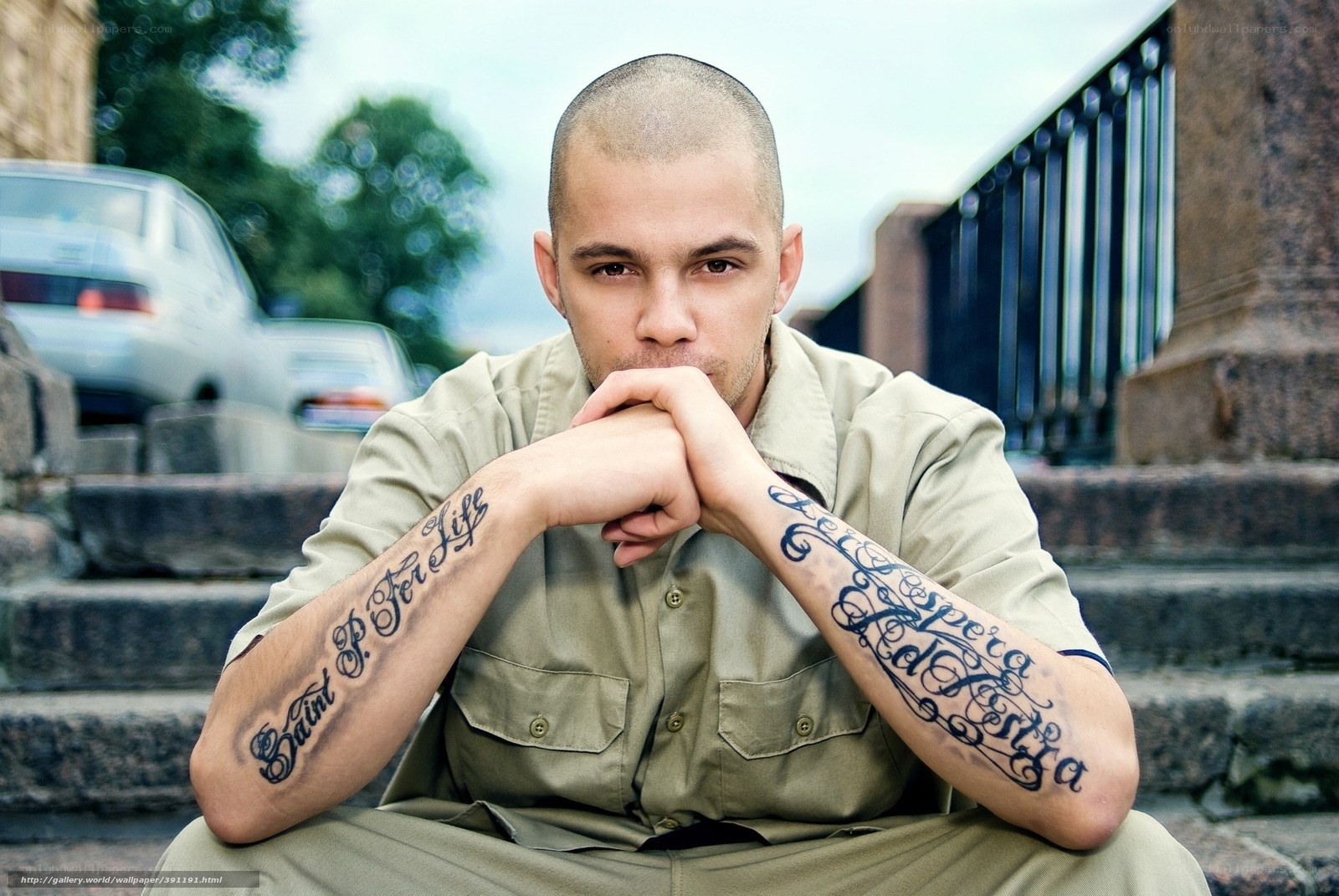 man with tattoos on arms