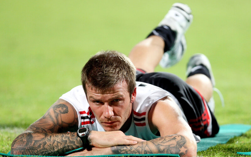 Man with Tattoos on Field