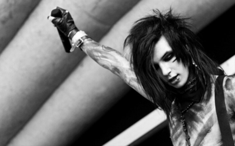Man with Tattoos on Stage — Black