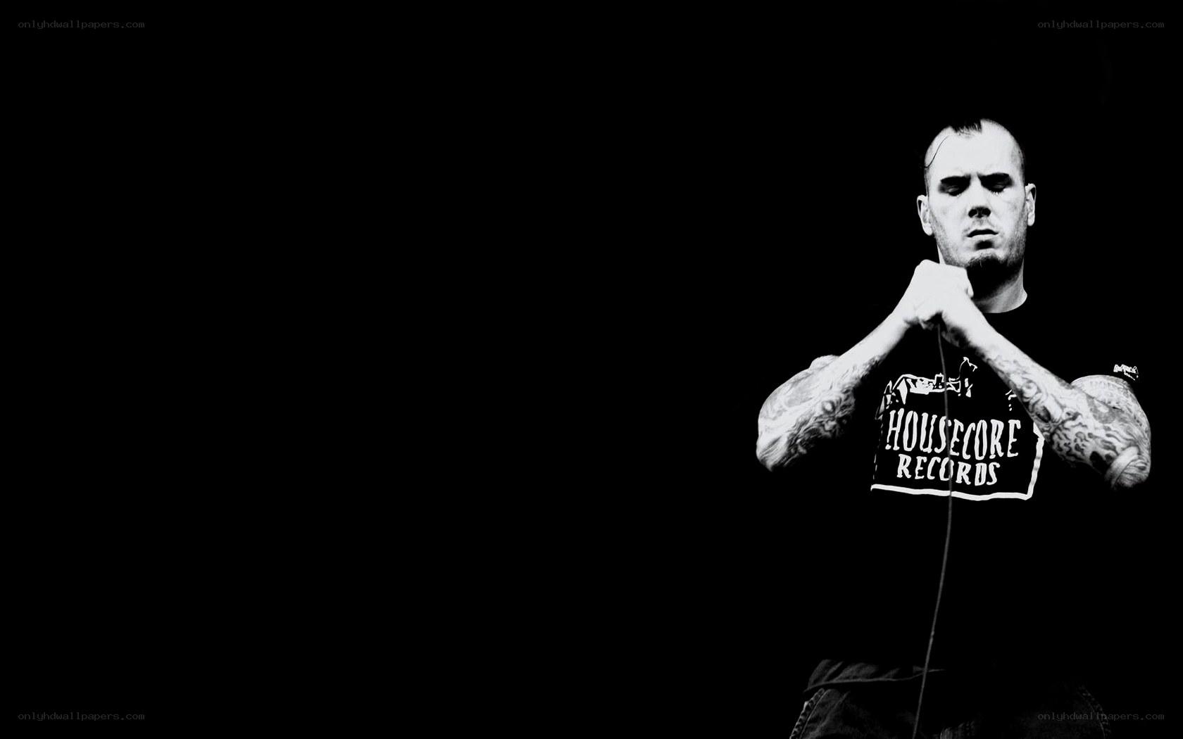 man with tattoos performing