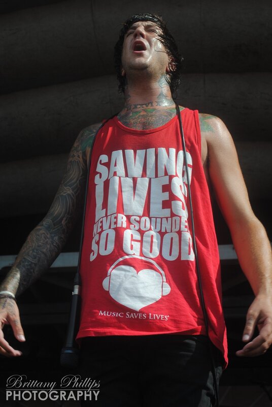 Man with Tattoos Singing — Red