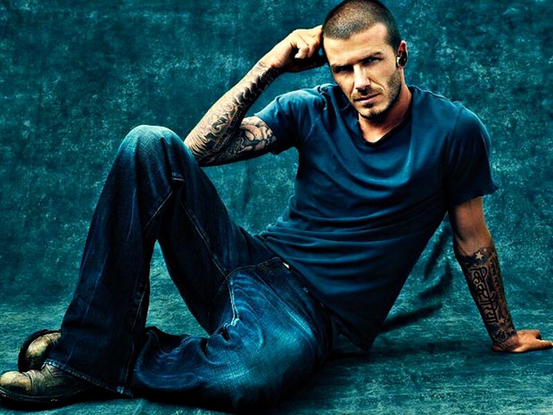 Man with Tattoos Sitting — Blue, Serious