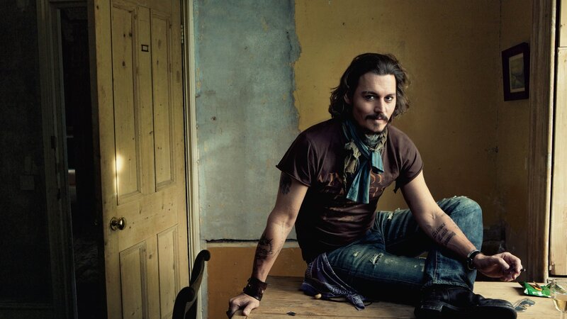 Man with Tattoos Sitting — Brown