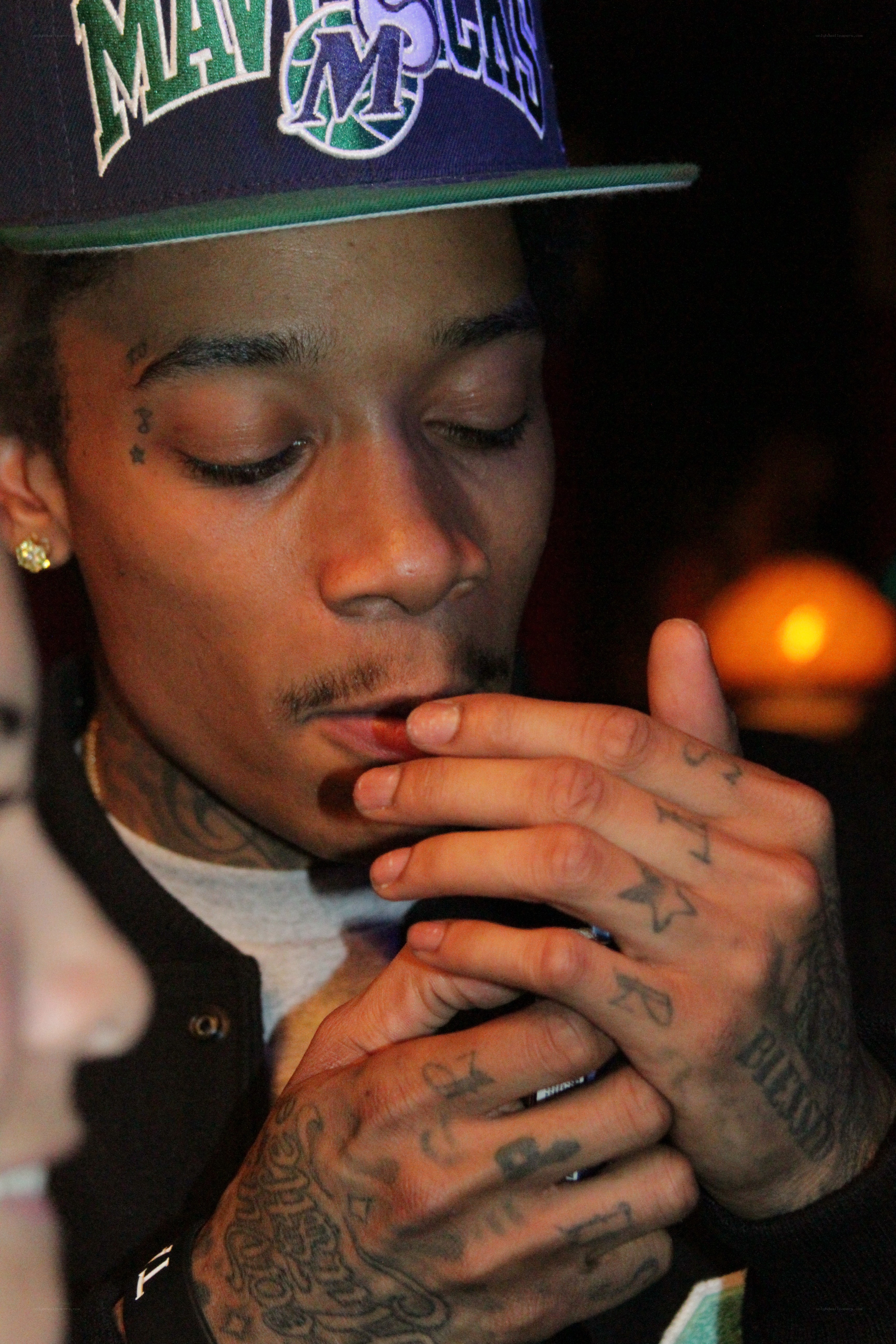 man with tattoos smoking