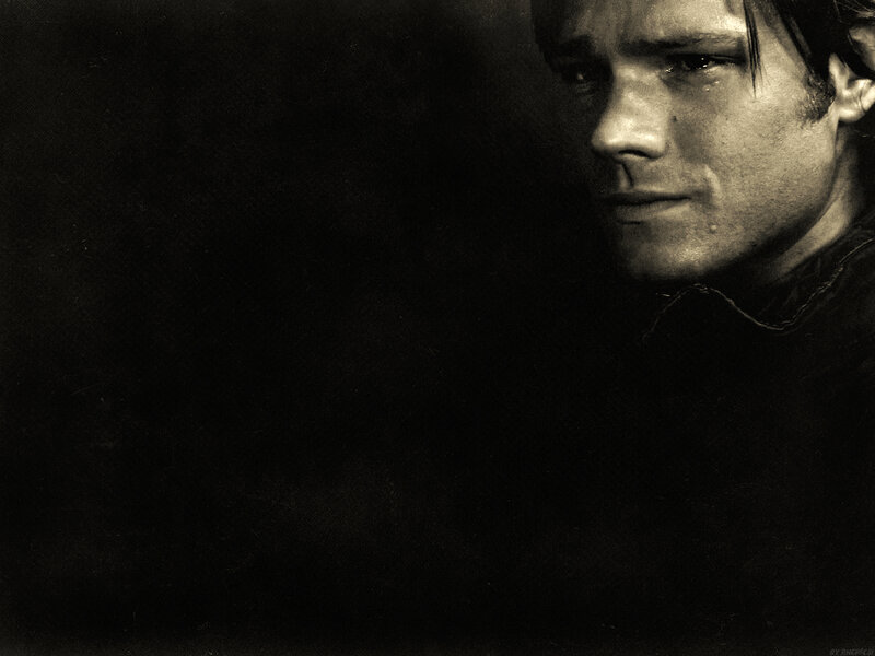 man with tear in eye